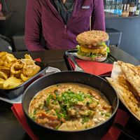 I had a "chicken" stew with garlic bread, and the lovely person opposite had a burger. We also had some potato dippers to share (left) at Vegangster in Rostock