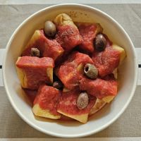 Chickpea tofu, tomato passata & olives at Mamma Michela  in Desenzano Del Garda