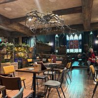 Looking down the room towards the pulpit and font, and all the seating areas. at Emporium Stories Feastery in Rotherham