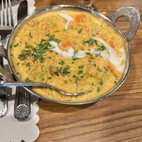 Vegetable coconut kurma and garlic naan 🤩  at Bombay Palace in Murray