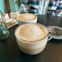 Chai Latte with Oat Milk (foreground), and Latte with Oat Milk (background) at Delicious   in Harrogate