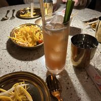 Singaporean cocktail and mango salad  at Laut in New York City