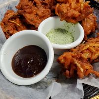 Pakora with tamarind sauce. The other one may have had dairy, we didn't eat it. at Momo Heaven in Carlisle