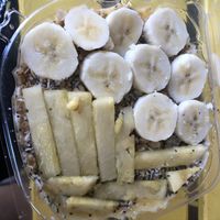 Tropical smoothies bowls- pineapple, banana, orange, mango (no maple syrup, or honey or peanut butter; only shredded coconut and hemp seeds and chia seeds on top )   at Raw Juice Bar in Orlando