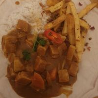 Steamed Jasmine rice, himalayan fries, Malaysian curry with plant based chicken. at Peppery Rose Alderley Edge in Alderley Edge