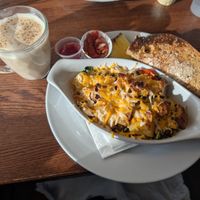 Chai latte with oat milk and vegan tofu Scrambler at Mill Creek Cafe in Edmonton