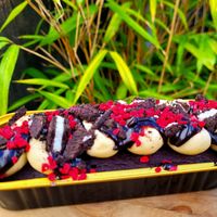 Create Your Own Custom Cake (Chocolate Sponge, Vanilla Icing, Chocolate Sauce, Oreo Topping, and Raspberry Topping). at Bel's Vegan Bakes - Pop-Up in Bangor