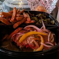 Vegan Hamburger Steak with sweet potato fries and collards. at Pierre's Soul Food in Spartanburg