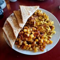 Scrambled tofu, bacon & potatoes with toast. at Mamalicious in Hamburg