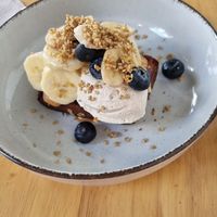 Banana bread with peanut butter, banana, and blueberries (the whipped cream was unexpected and was so light and cloudy) at Lōf Bakery in Barcelona