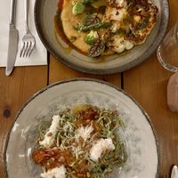 Cauliflower steak and spaghetti with creamy sauce and pistachioos  at Kin Restaurant in London