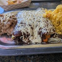 Vegan enchiladas combo with pinto beans & rice, with the $3 extra cheese. at Salena's in Rochester
