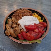 Ensalada con Heura, maíz, cebolla crispa, tomate y una salsa estilo tártara. at El Jardí in Girona