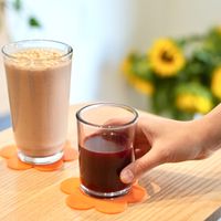 Cold pressed juice and the most popular smoothie, the Choco Brain: organic cacao, dates, banana, reishi and maca adaptogens, almond butter, cinnamon, almond milk. 100% vegan. at Curiosa | Cafe & Juice Bar in Mexico City