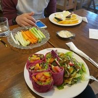 vegan hummus and veggie plate and vegan rolls with stir fried veggies and pesto sauce.  at Backyard Cafe in Beijing