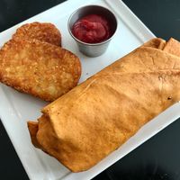 Breakfast burrito. Good, but the pre-made fast food style hashbrown was disappointing.  at Higher Taste Plant Based in Long Beach