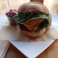 Umm  DIED AND GONE TO HOG HEAVEN MINUS THE HOG. THANK YOU MICHELLE AND CHEF. THE BUN IS ABSOLUTELY PERFECT FOR THIS BURGER RIGHT Amount OF HEAT ..I HAD THE AVACADO JALAPENO BURGER. at Higher Taste Plant Based in Long Beach