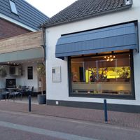 Storefront and small terrace at Restaurant 22  in Bennekom