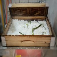 Steaming hot coconut shavings at ThatPutuMayamStall in Central Singapore