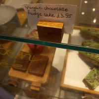 Sign for vegan fudge cake at Little Things Cafe  in Dundee