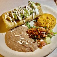 Chimichanga with  Egan upton’s chorizo, cheese, sour cream,  beans, salsa Fresca, and  rice  at La Cantina in Chicago