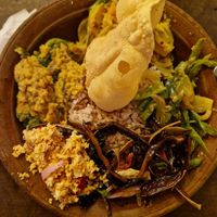 Rice and four vegetable curries with papadam at House of Kitchen in Ella