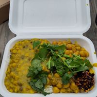 Vegan chickpea curry with rice dhal and homemade chilli oil at Tibet Flavour in Ely