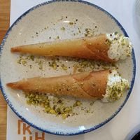 The waitress gave us these for free, pistachio cream inside, so good. at GNOU in Athens