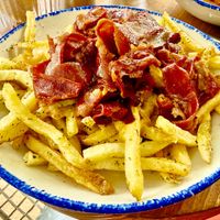 Cheesy fries and bacon. at GNOU in Athens