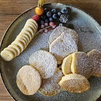 Mini pancakes with fruit at Coffee Brew Düsseldorf CAFÉ & BAR in Dusseldorf