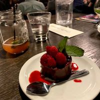 Vegan chocolate cake with raspberry coulis at Spotlight Cabaret  in Edmonton