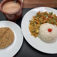 Prato executivo com hambúrguer de grão de bico e legumes (também acompanhado da salada)  at Mariá Restobar in Goncalves
