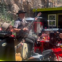 Live music playing in outdoor seating area  at Bisbee Badassery  in Bisbee