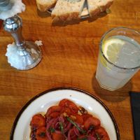 Top: carrot-beetroot soup with fresh focaccia bread. Bottom: smokey carrots and their homemade mandarine-scrub drink (like a lemonade/ "Sirup"). Delicious! at Kleinwäscherei in Zurich