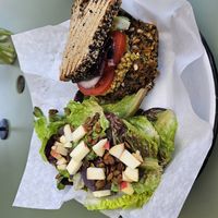 Lentil veggie patty with side caesar salad at Farmer and The Cook Cafe in Ojai