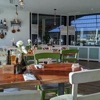 View of the tennis courts inside and outside at Taverna Athos in Leinfelden-echterdingen