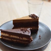 Tiramisu cake slice (behind) + chocolate layer cake (in front) at Little Bird Kitchen in Auckland