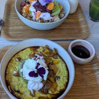 I had granola (in the back) with the green juice and my friend had the porridge!!   at Little Bird Kitchen in Auckland