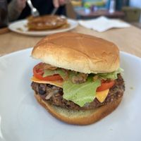 Delicious made from scratch black bean burger. Pumpkin pancakes in the background. at VGarden Caffé in Luquillo