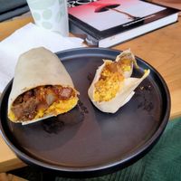 Breakfast Burrito with tofu scramble, impossible sausage and other yummy ingredients. Partly devoured. at Witness Coffee Roasters in Eureka