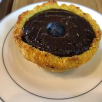 GF Pastry. Shaved coconut crust with cashew cacao cream filling at Bio Solo Organico in Buenos Aires