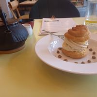 Pistachio and berry cream puff and a pot of earl grey tea with oat milk, LAS, 29/4/25 at LAS in Lodz