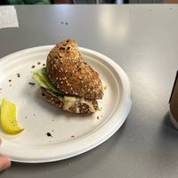 Half of a hummus, lettuce, and tomato on everything bagel.  at Cafe Fresh Bagel in Needham Heights