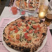 Vegan pizza with grilled vegetables - added extra tomatoes as topping at Pizza Beppe in Alkmaar