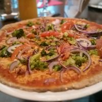 brokkoli, onion and tomato Pizza with spelt dough at Pizzeria Casa Piccola in Vienna