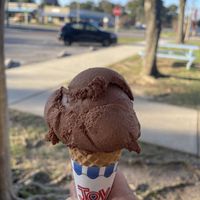 Chocolate Peanut Butter Fudge Ice Cream on a sugar cone that is vegan   at Fannie Lou's Ice Cream in Pensacola