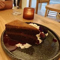 Chocolate cake with berry coulis and cream at DÔME in Mallorca