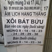 Notice with hours at the top at Phát Tâm  in Ho Chi Minh City