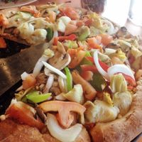 Medium "Grateful Veg" pizza with artichoke hearts instead of olives, wheat crust, non-raw tomatoes at Woodstock's Pizza - Pacific Beach in San Diego