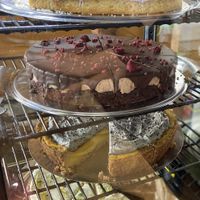 Pies Sunday 24 August 2025: the top one is a white chocolate/lavender mousse pie. It’s mild and creamy, with lime peel on top. at KLUTS in Utrecht